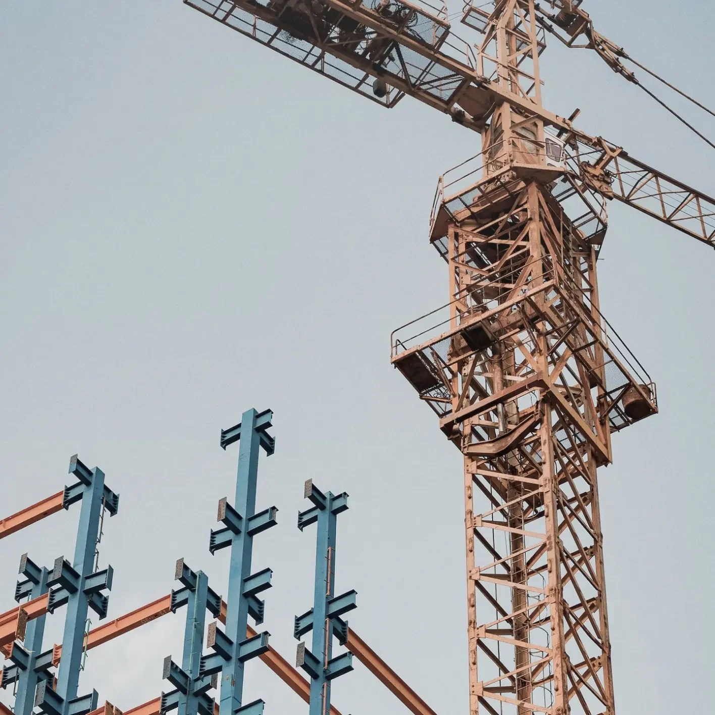 A crane sits on top of a steel structure