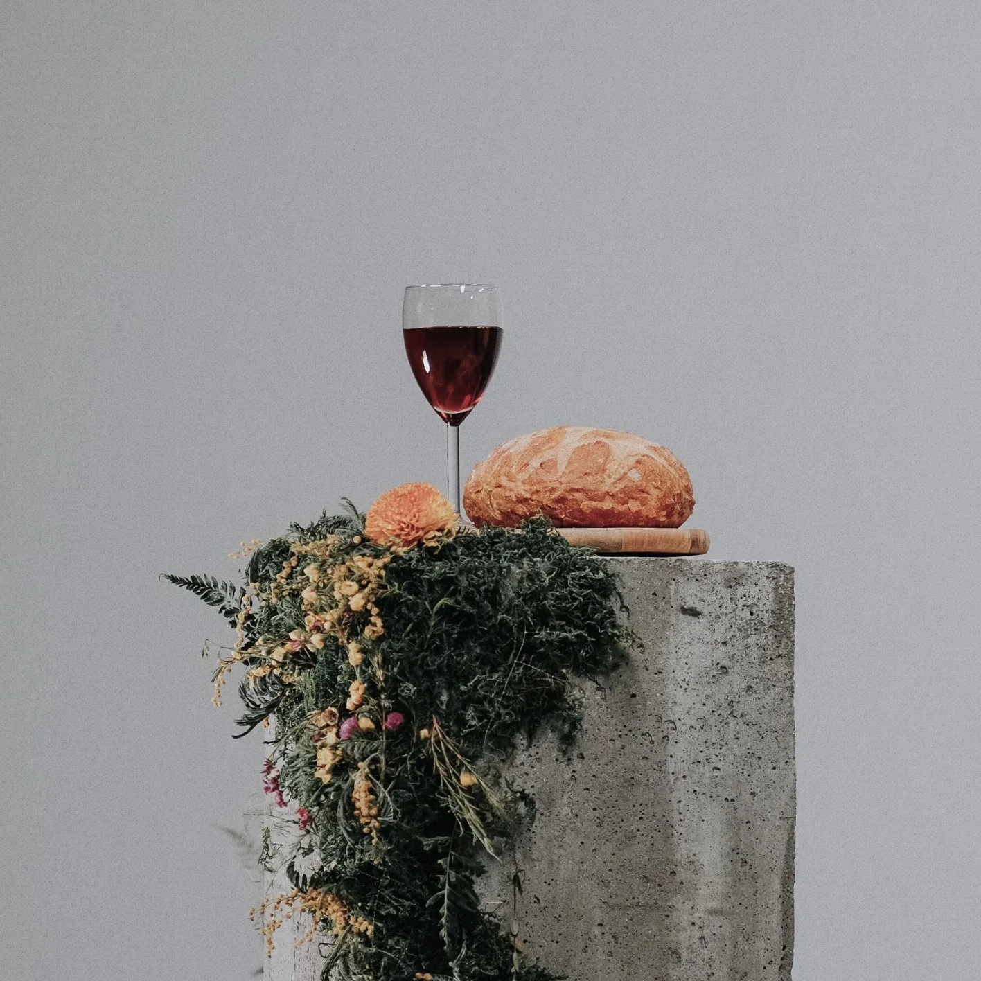 Wine and bread on stone table